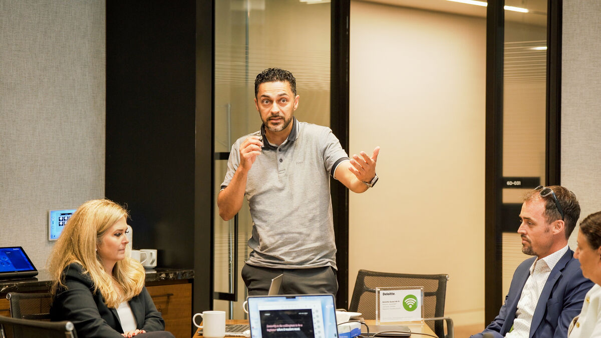 A coach working alongside an executive at the Lab