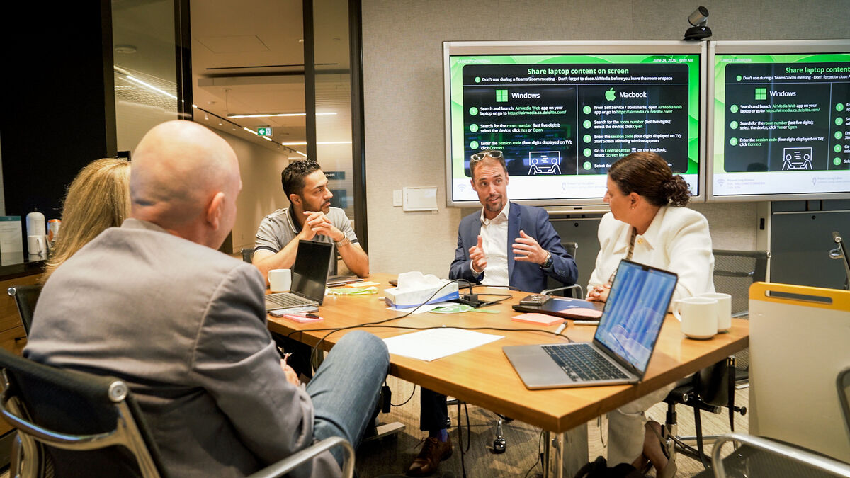A table of executives at a Lab