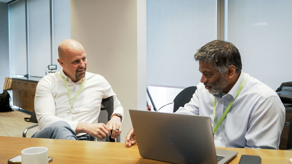 Two executives at a laptop