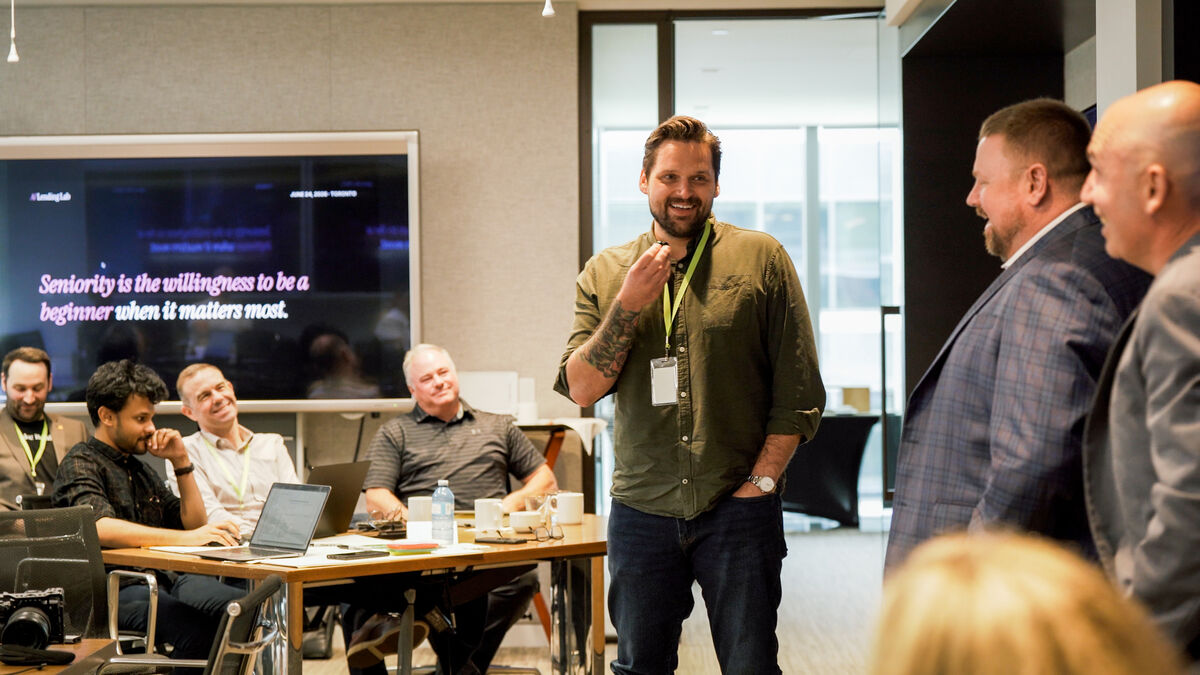 Senior lending leaders at the Lab, with the rule of the day on screen behind them